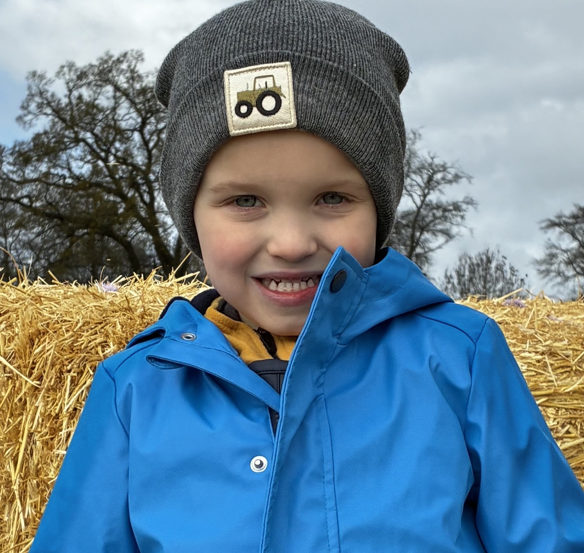 boy in blue outdoor coat